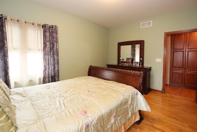 bedroom with light hardwood / wood-style floors