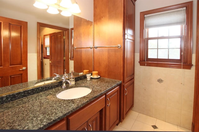 bathroom featuring tile walls, vanity, and tile patterned floors