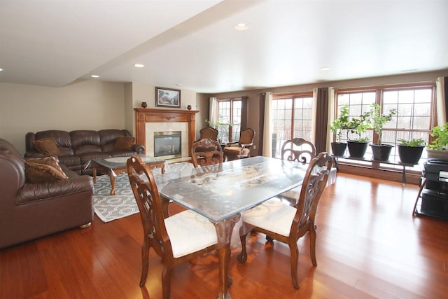 dining space with hardwood / wood-style floors