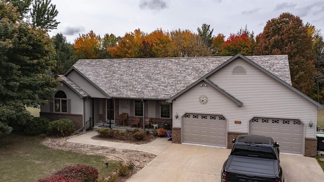 ranch-style house featuring a garage and a porch