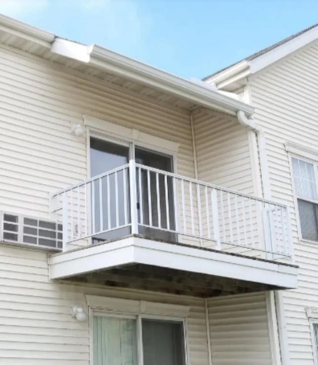 view of side of home with a balcony