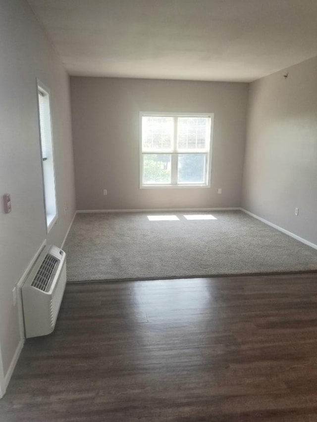 empty room featuring dark hardwood / wood-style floors