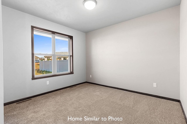 empty room featuring carpet flooring