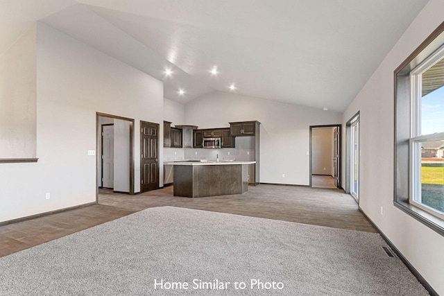 kitchen featuring a kitchen island, plenty of natural light, and light wood-type flooring