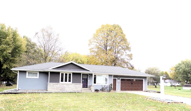 single story home with a front yard and a garage