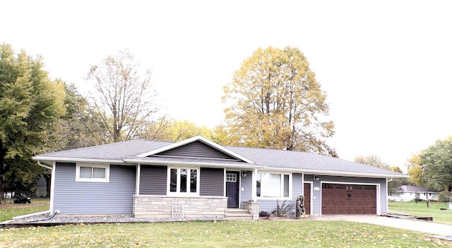 ranch-style house with a front yard and a garage