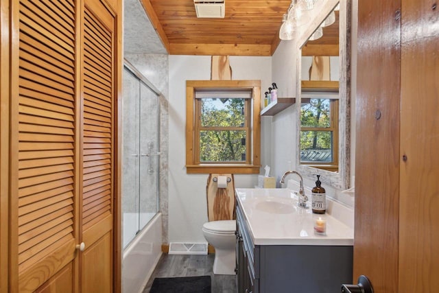 full bathroom with wood ceiling, toilet, hardwood / wood-style floors, vanity, and combined bath / shower with glass door