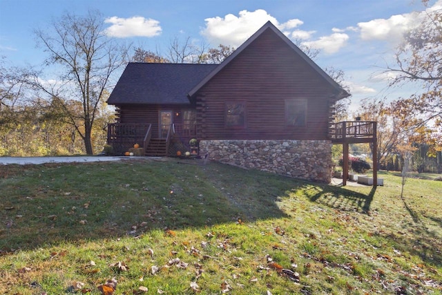 view of property exterior featuring a wooden deck and a yard