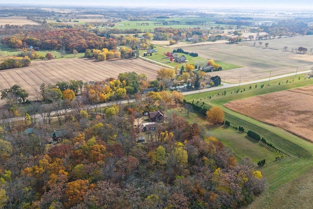 birds eye view of property with a rural view