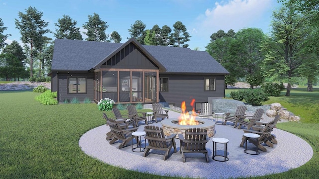 rear view of property with a sunroom, a lawn, a patio, and an outdoor fire pit