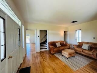 living room featuring plenty of natural light and hardwood / wood-style flooring