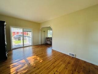 spare room featuring dark hardwood / wood-style flooring