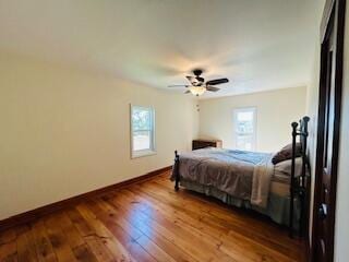 bedroom with ceiling fan and wood-type flooring