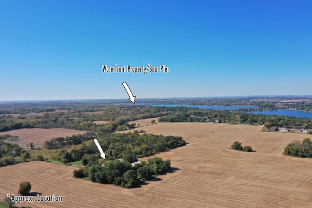 birds eye view of property with a rural view