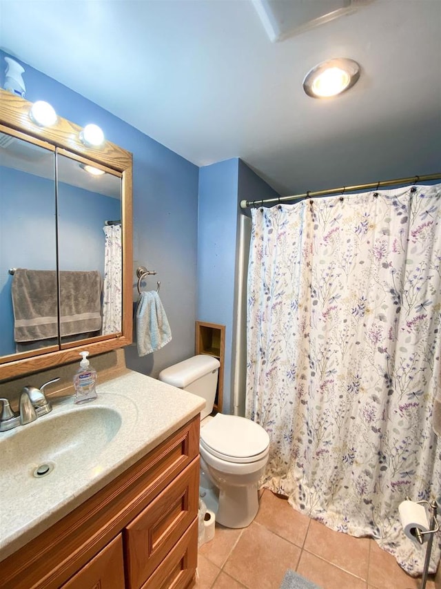 bathroom with tile patterned floors, vanity, toilet, and a shower with shower curtain