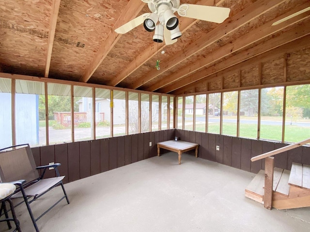 sunroom featuring ceiling fan, plenty of natural light, and vaulted ceiling