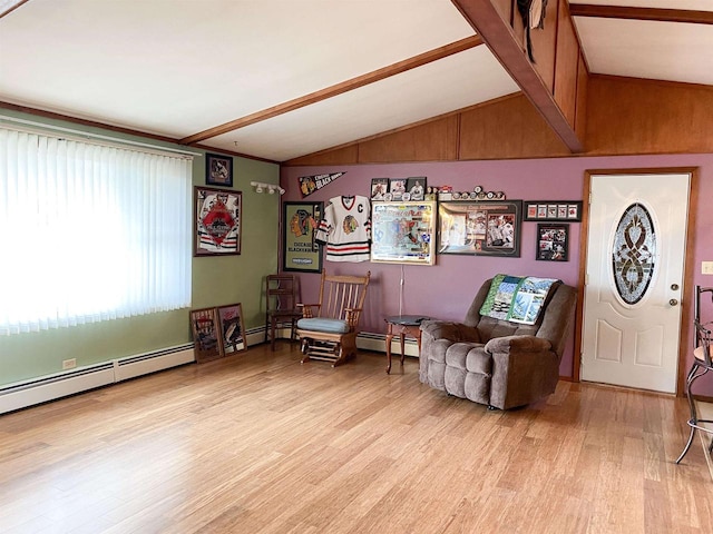 living area featuring a baseboard radiator, lofted ceiling, and light hardwood / wood-style floors