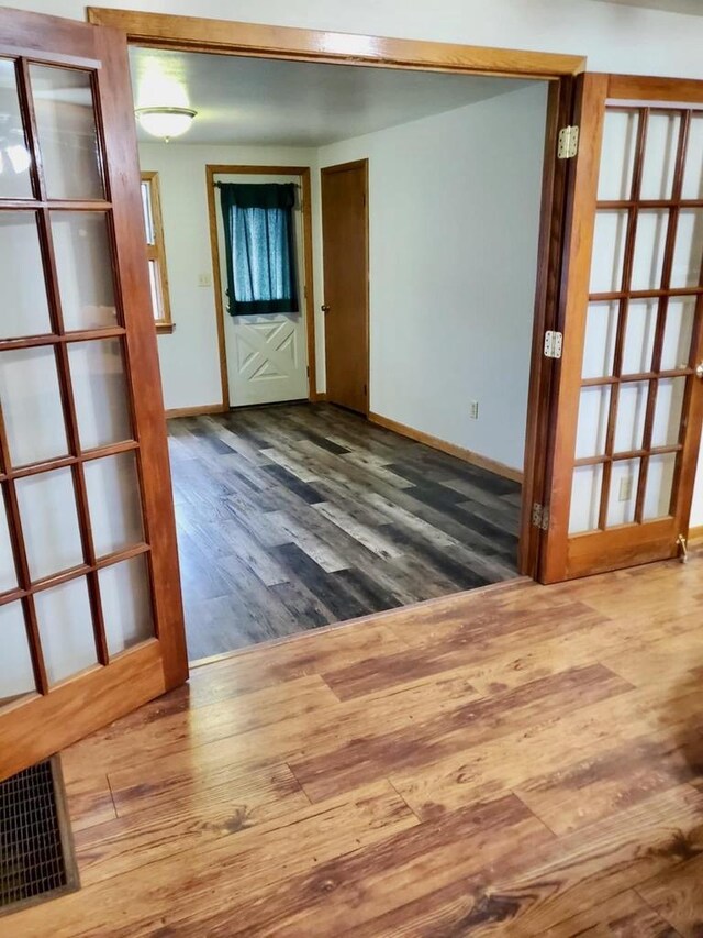 N8709 5th Ave, Camp Douglas, WI 54618 - unfurnished room with wood finished floors and baseboards