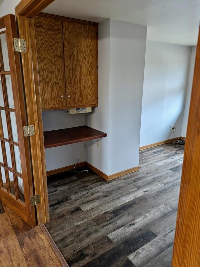 N8709 5th Ave, Camp Douglas, WI 54618 - kitchen featuring baseboards and dark wood-type flooring