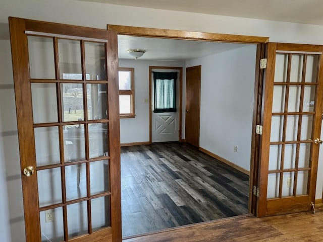 N8709 5th Ave, Camp Douglas, WI 54618 - foyer with baseboards, dark wood-style floors, and french doors