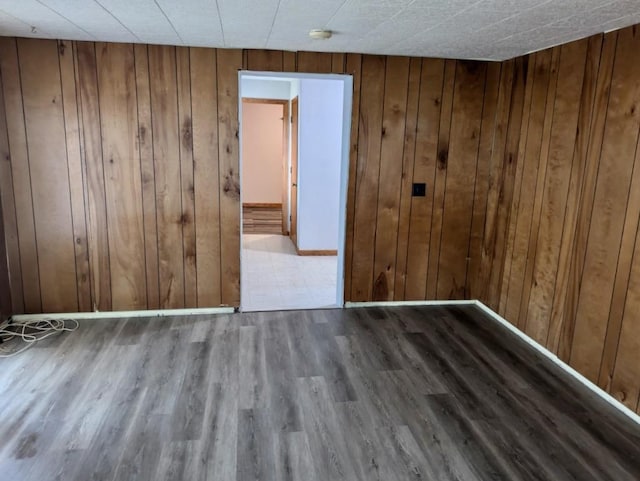 N8709 5th Ave, Camp Douglas, WI 54618 - empty room featuring wood walls and wood finished floors