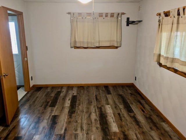 N8709 5th Ave, Camp Douglas, WI 54618 - empty room featuring wood finished floors and baseboards