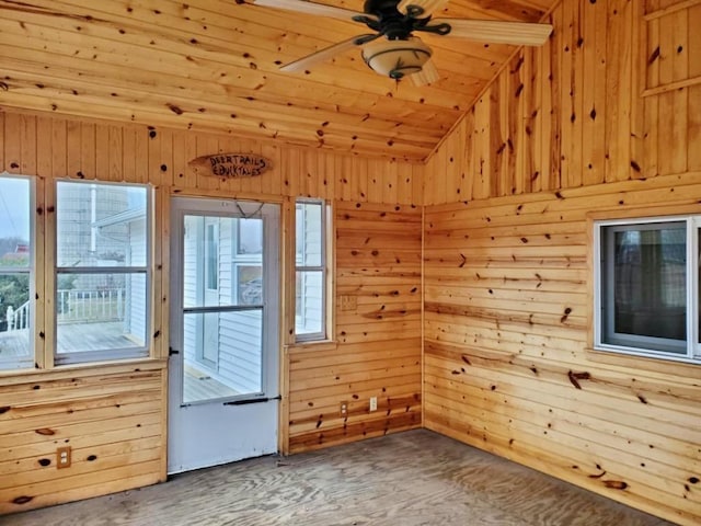 N8709 5th Ave, Camp Douglas, WI 54618 - empty room featuring lofted ceiling, wood walls, wood ceiling, wood finished floors, and ceiling fan