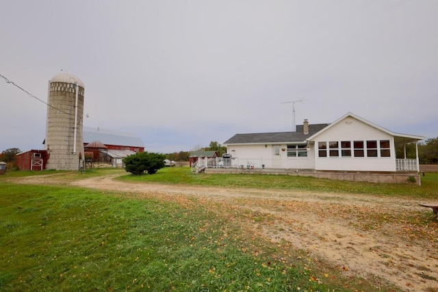 N8709 5th Ave, Camp Douglas, WI 54618 - back of property with a lawn