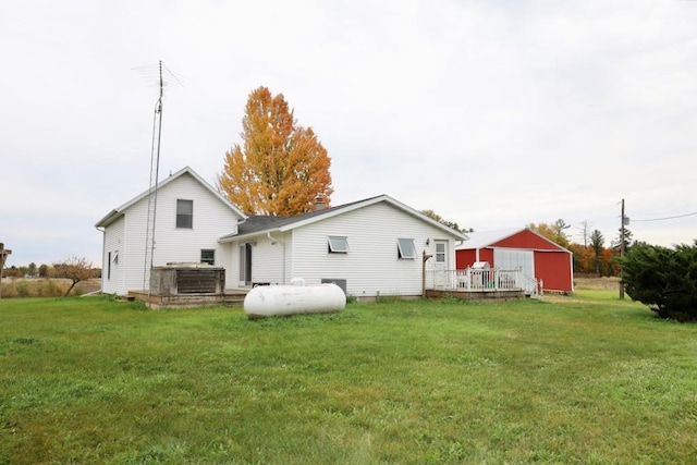 N8709 5th Ave, Camp Douglas, WI 54618 - back of property with a deck and a lawn
