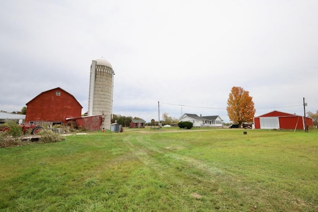 N8709 5th Ave, Camp Douglas, WI 54618 - view of grassy yard with a barn, an outdoor structure, and a detached garage