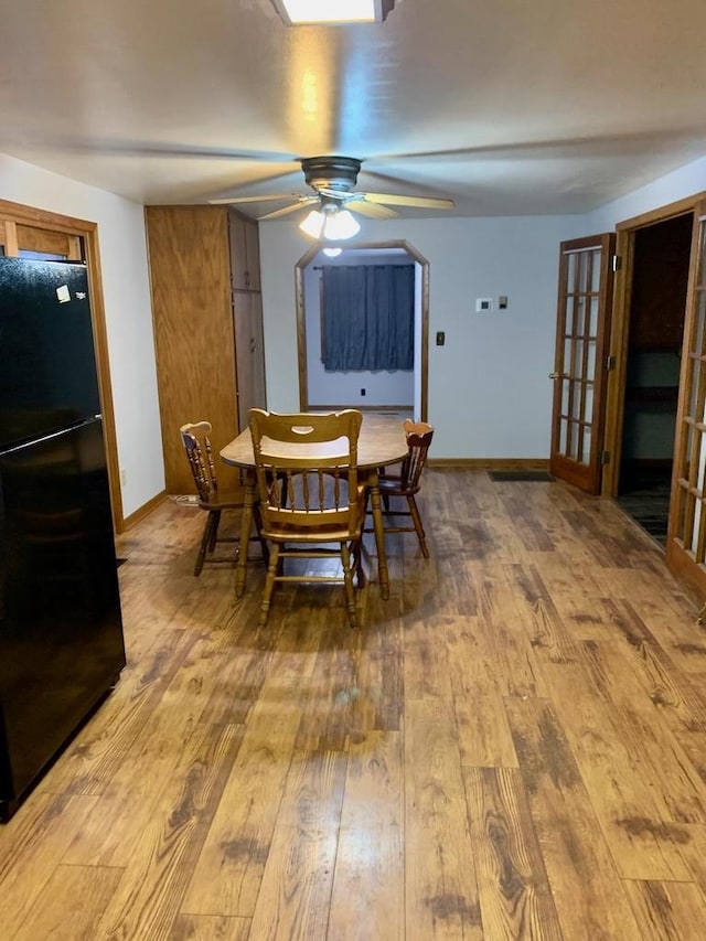 N8709 5th Ave, Camp Douglas, WI 54618 - dining space with hardwood / wood-style floors, baseboards, and a ceiling fan