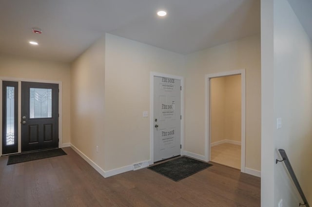 1003 E 10th St, Merrill, WI 54452 - foyer featuring dark wood finished floors, baseboards, and recessed lighting