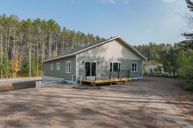 back of house featuring a deck