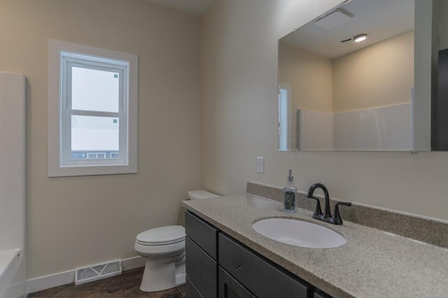 1003 E 10th St, Merrill, WI 54452 - full bath with vanity, toilet, and baseboards