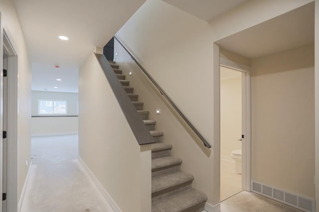 1003 E 10th St, Merrill, WI 54452 - stairway featuring recessed lighting and baseboards