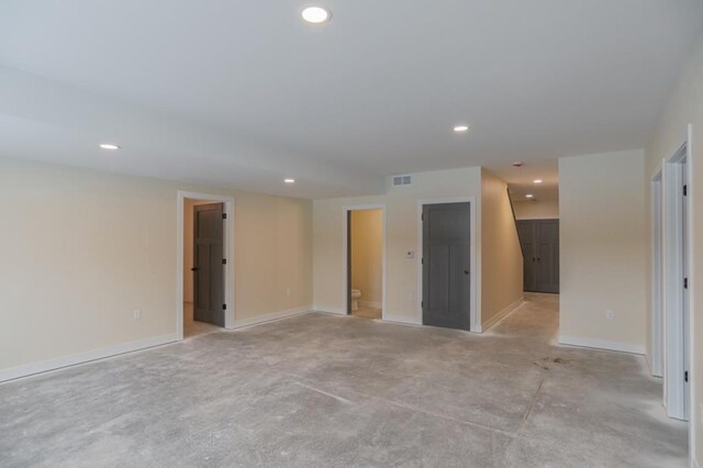 1003 E 10th St, Merrill, WI 54452 - spare room with recessed lighting, baseboards, and light carpet