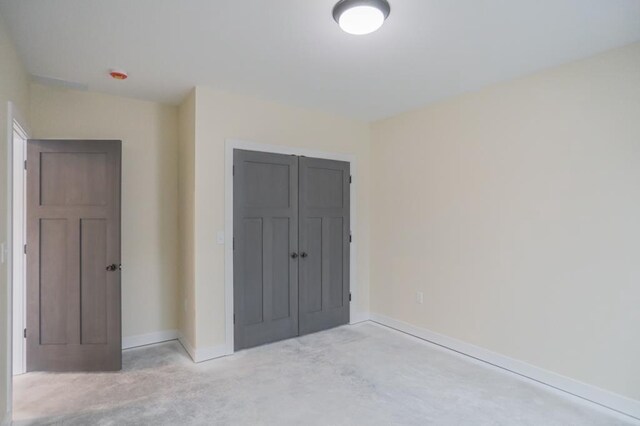 1003 E 10th St, Merrill, WI 54452 - unfurnished bedroom with a closet and baseboards