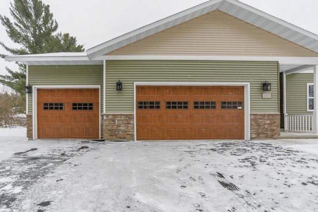 1003 E 10th St, Merrill, WI 54452 - snow covered garage with a detached garage