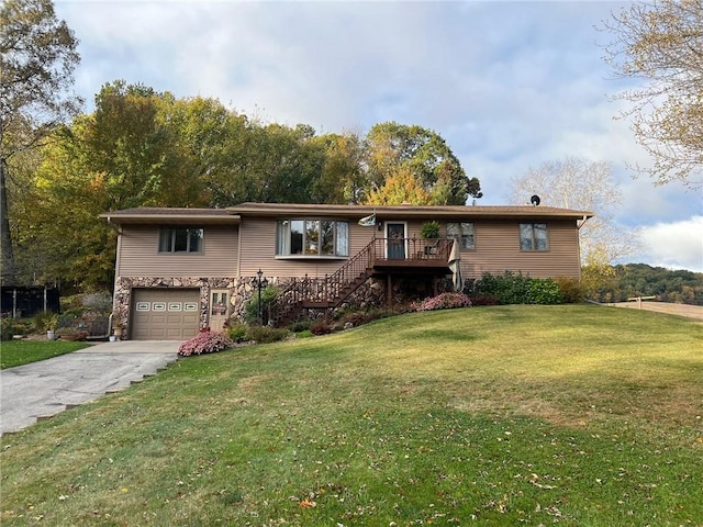 view of front facade featuring a garage, a wooden deck, and a front lawn