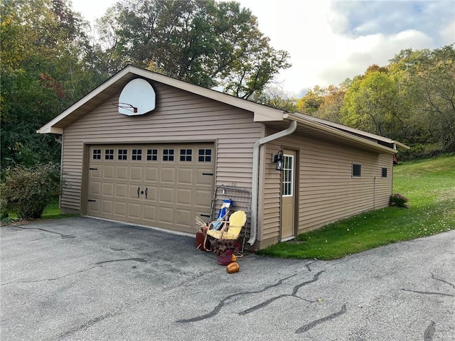 garage with a yard