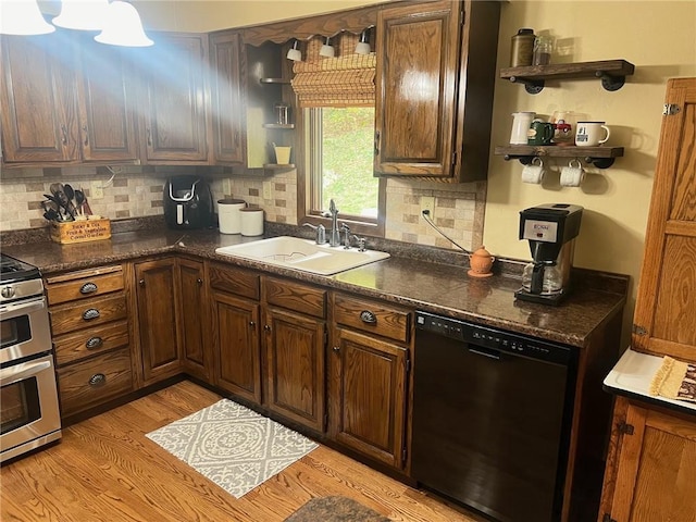 kitchen with tasteful backsplash, sink, light hardwood / wood-style flooring, double oven range, and dishwasher