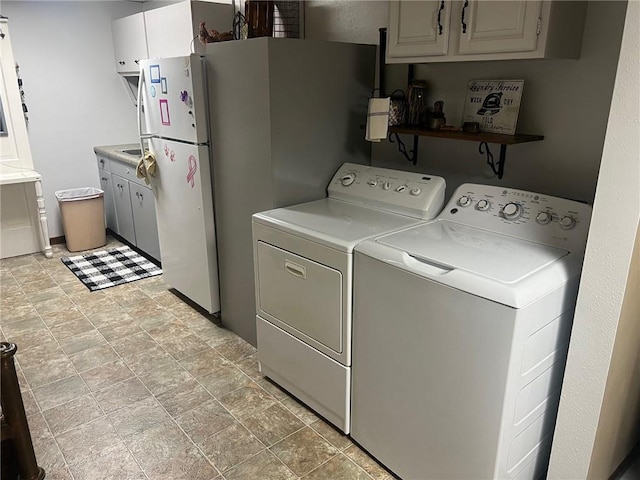 washroom with washer and dryer