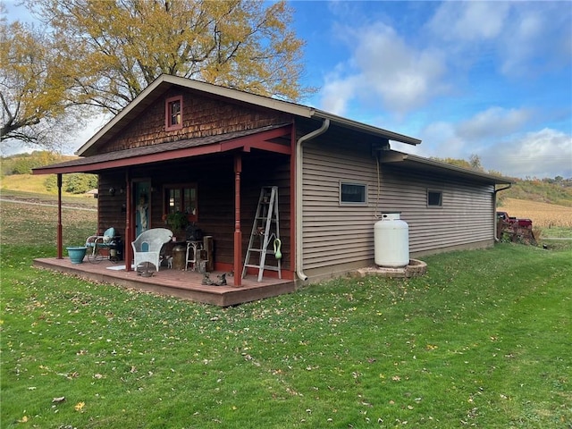 view of outbuilding featuring a lawn