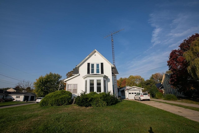 view of front of house featuring a garage and a front lawn