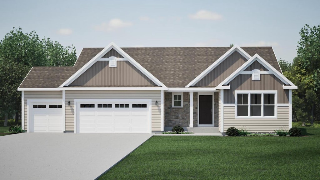 craftsman inspired home with a front yard and a garage