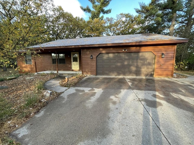 ranch-style home featuring a garage