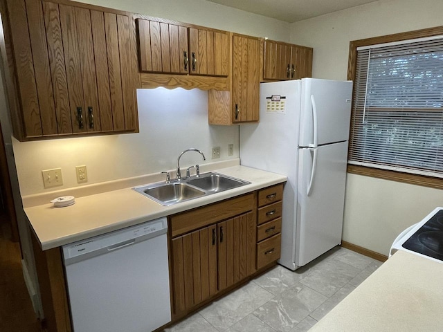 kitchen with sink and white appliances