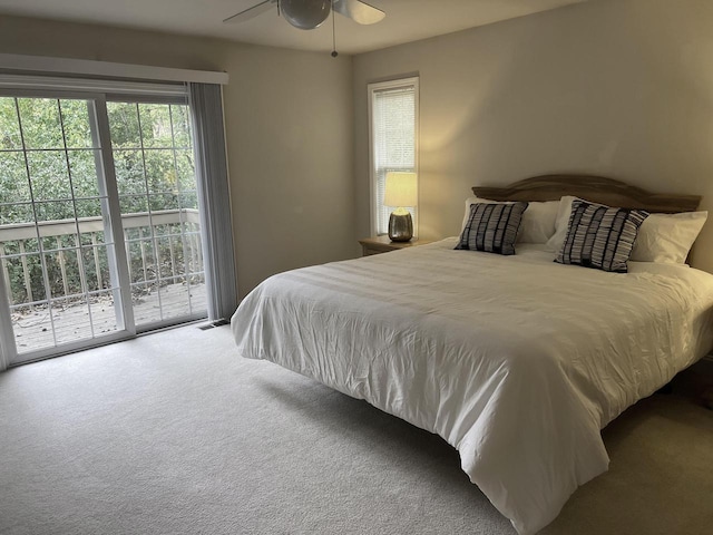 carpeted bedroom featuring access to outside and ceiling fan