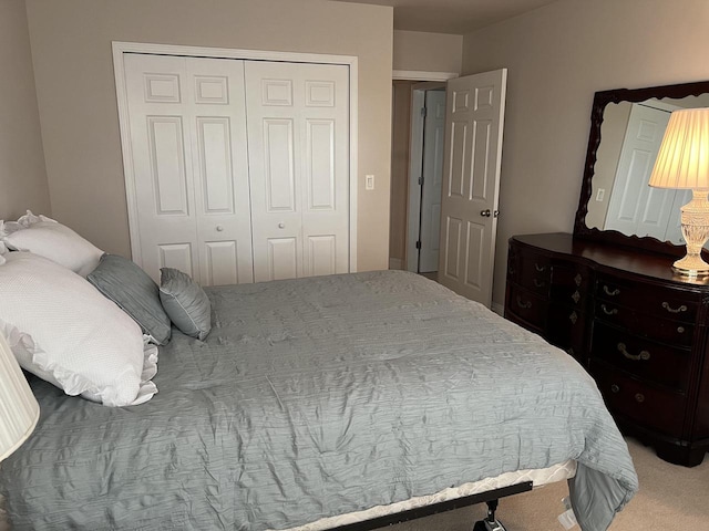 carpeted bedroom featuring a closet