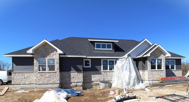 2352 Lonnie Ct, Sun Prairie, WI 53590 - craftsman-style house featuring stone siding, a shingled roof, and central AC